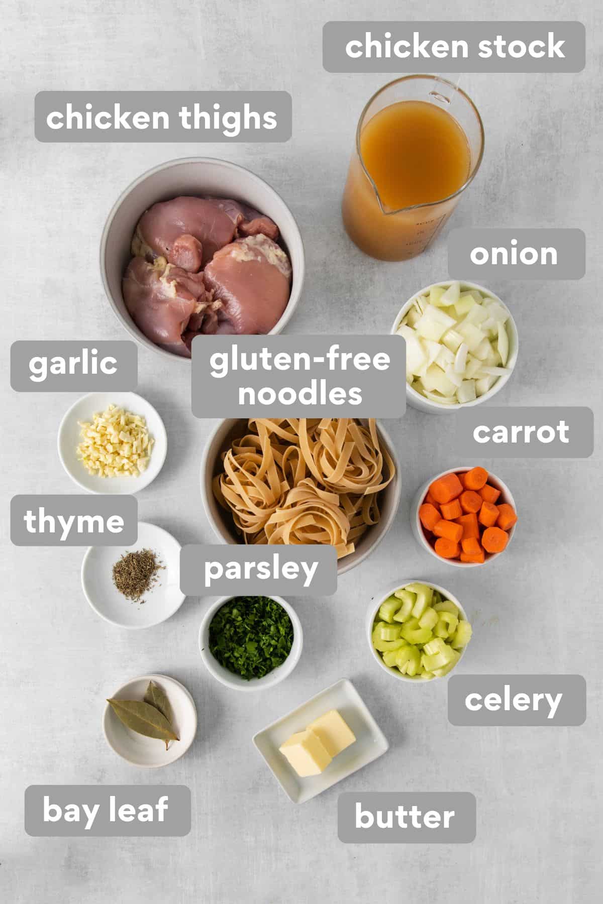 Ingredients for gluten-free chicken noodle soup on a counter top
