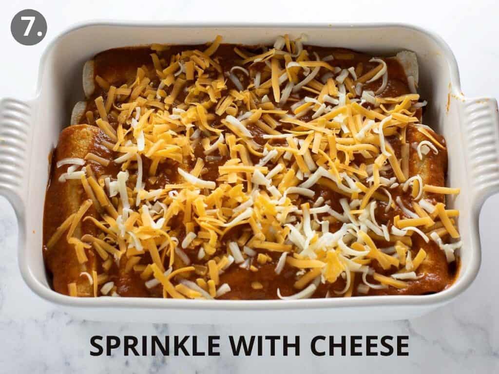 gluten free enchiladas in white pan covered with cheese before baking