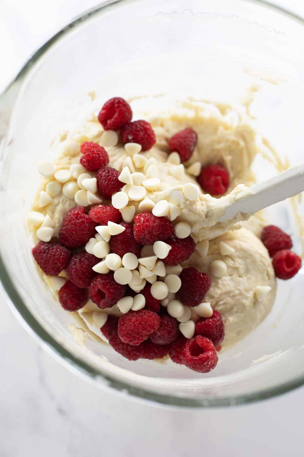 raspberry and white chocolate mixing into batter