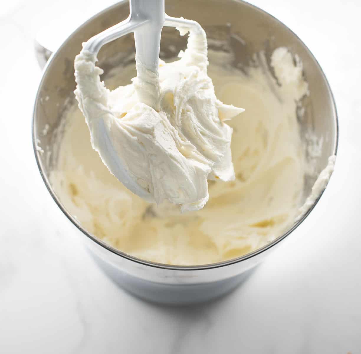 vanilla buttercream frosting in bowl after being whipped together