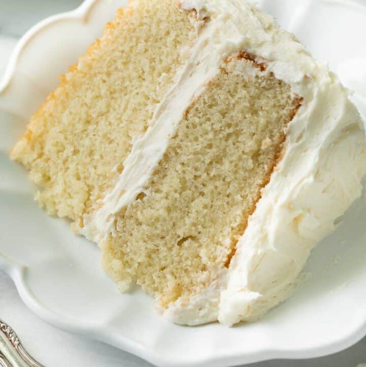 slice of gluten free vanilla cake on white plate