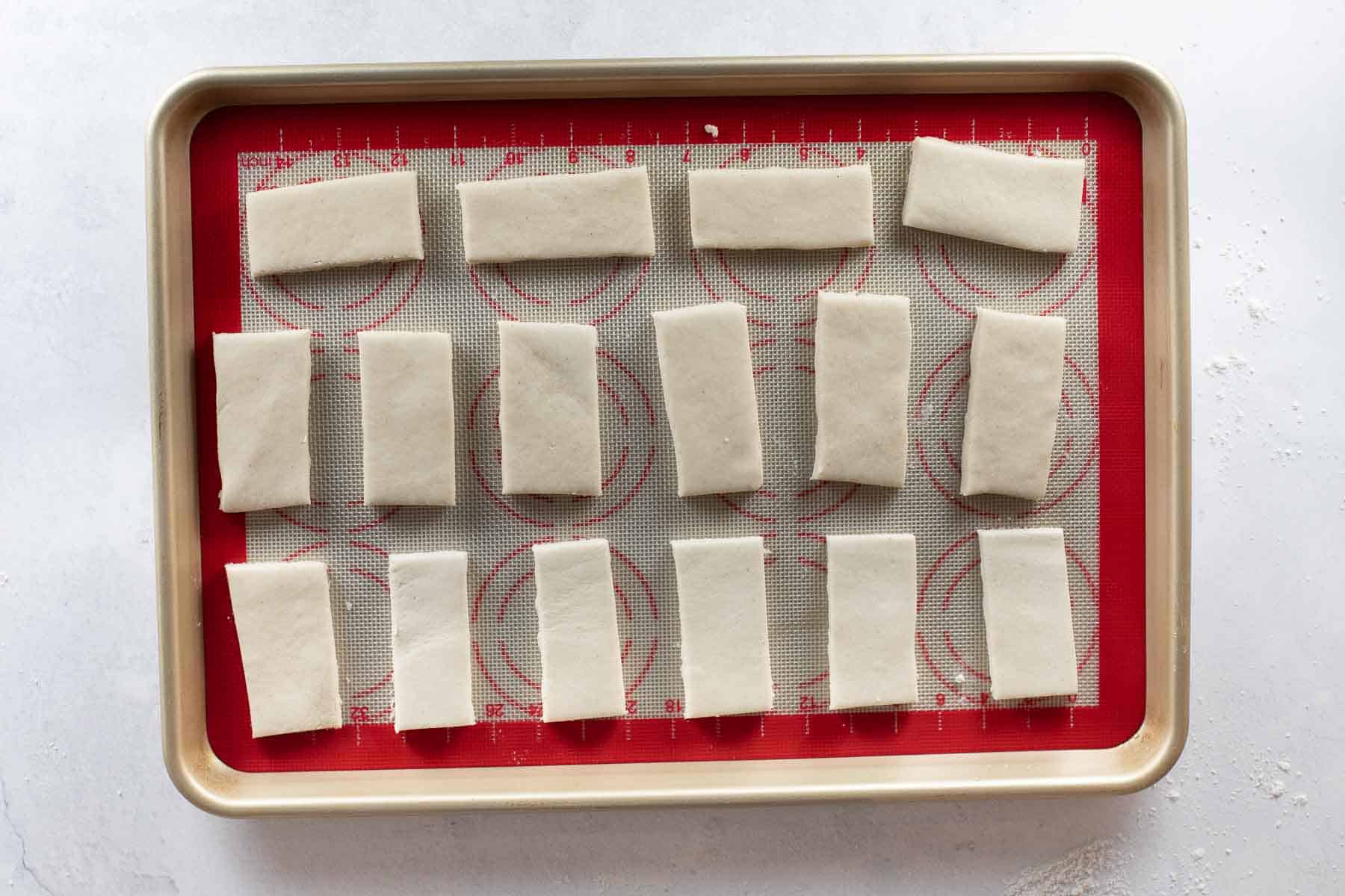 shortbread cookies cut out on baking sheet