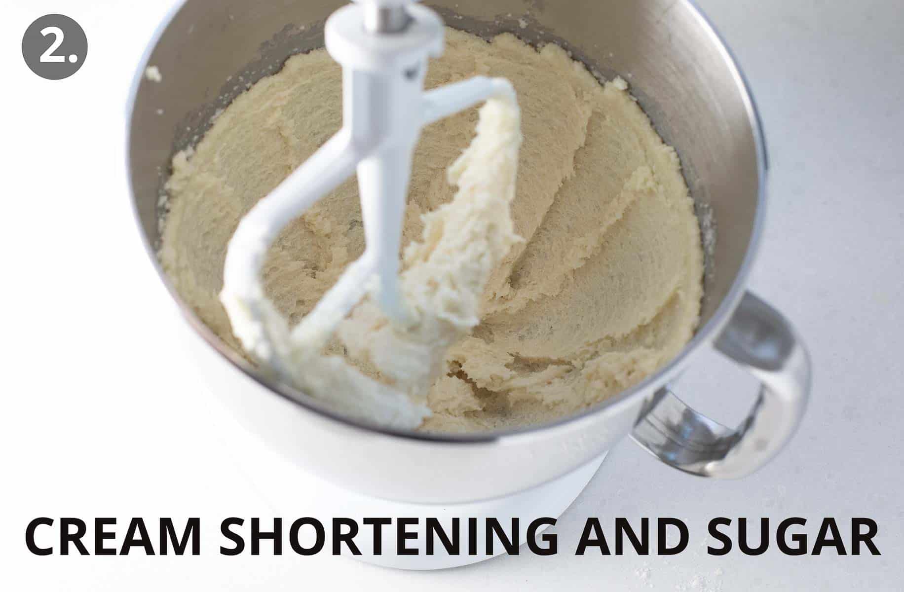 shortening and sugar being creamed in stand mixer