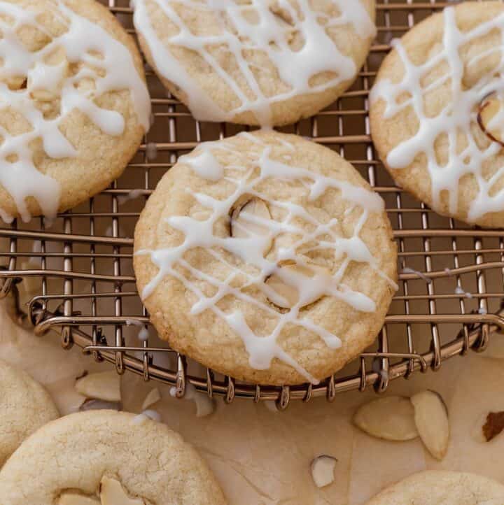 gluten free almond cookies on cooling rack topped with glaze