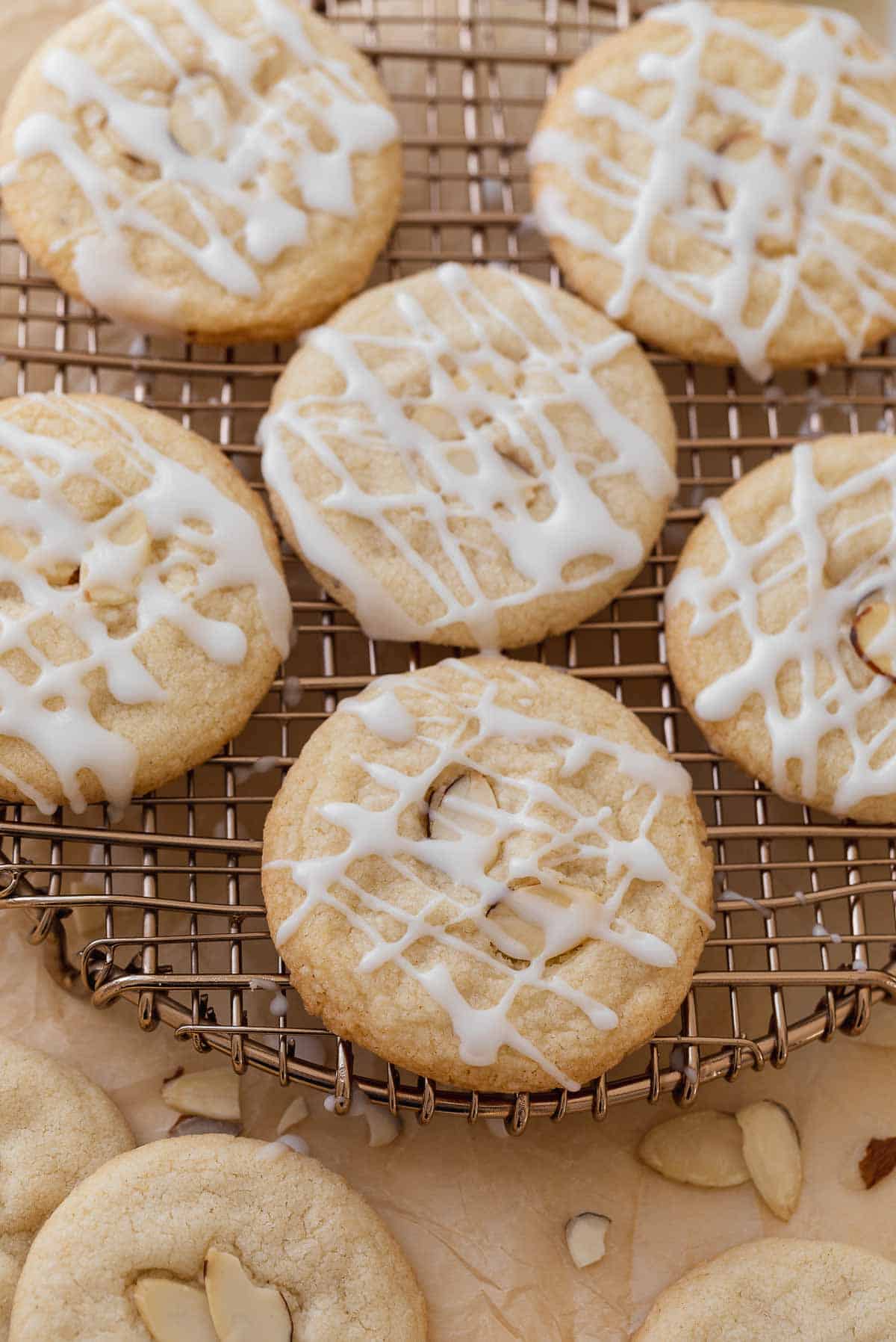 gluten free almond cookies on cooling rack topped with glaze