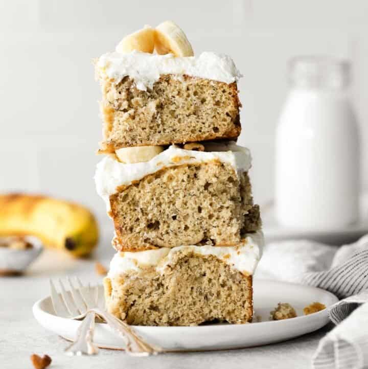 Banana cake slices stacked on a plate