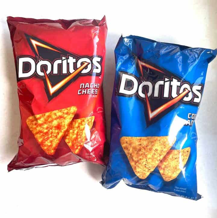 bag of nacho cheese and bag of cool ranch doritos on white background