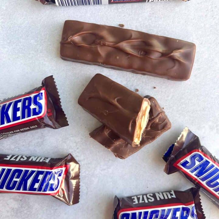 mini snickers on counter with snickers bar cut in half