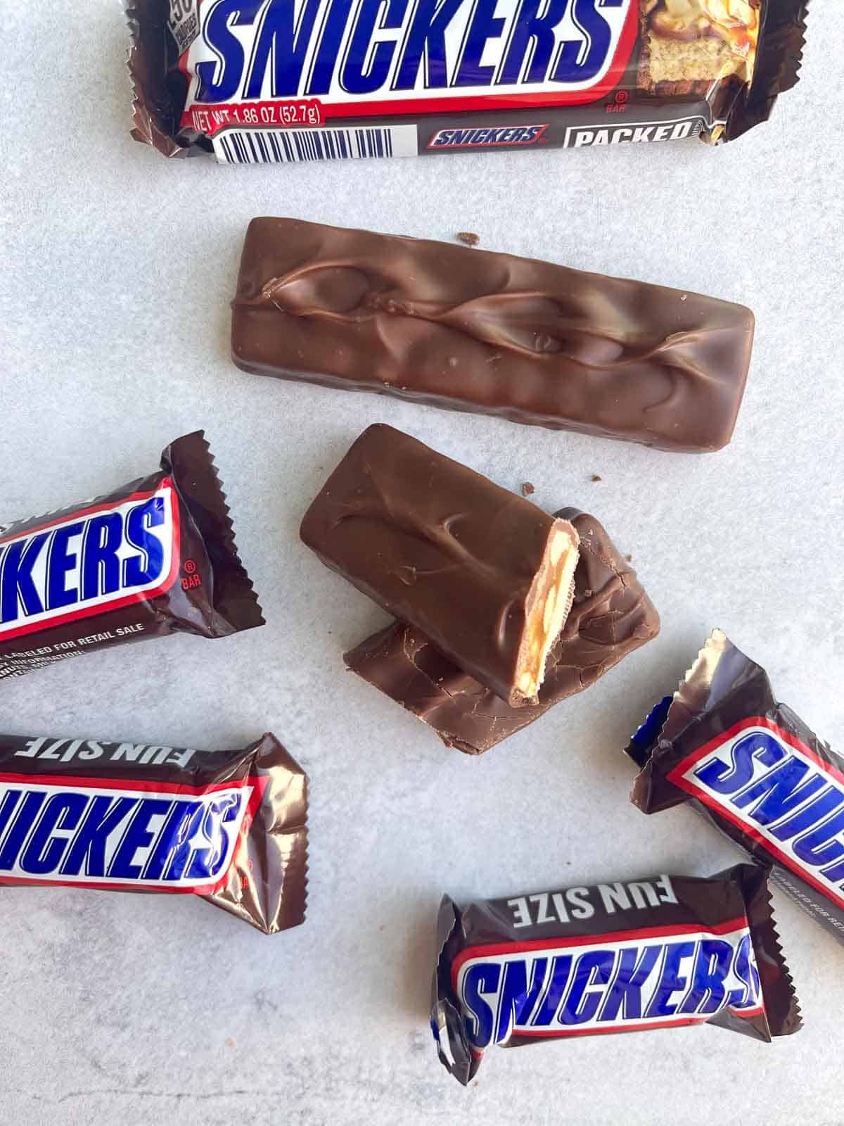 mini snickers on counter with snickers bar cut in half