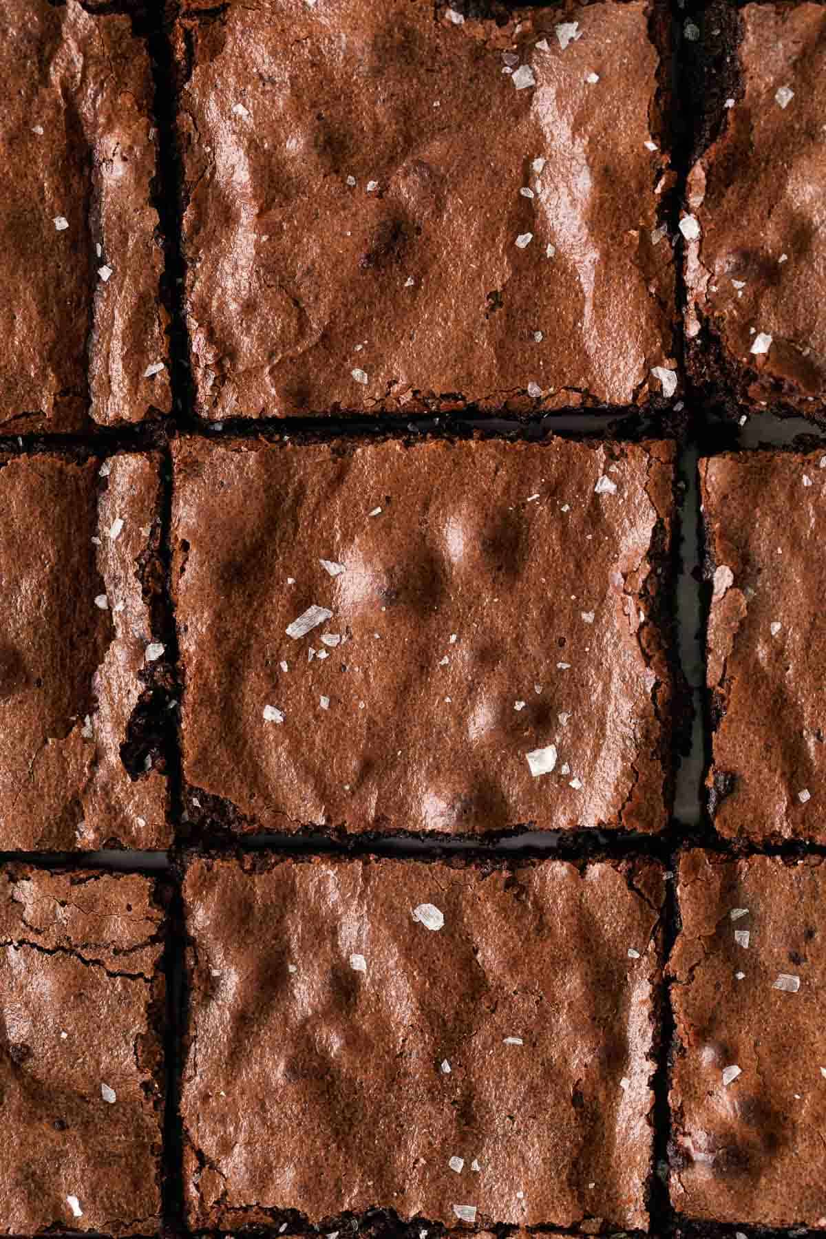 close up of gluten free brownies sprinkled with sea salt