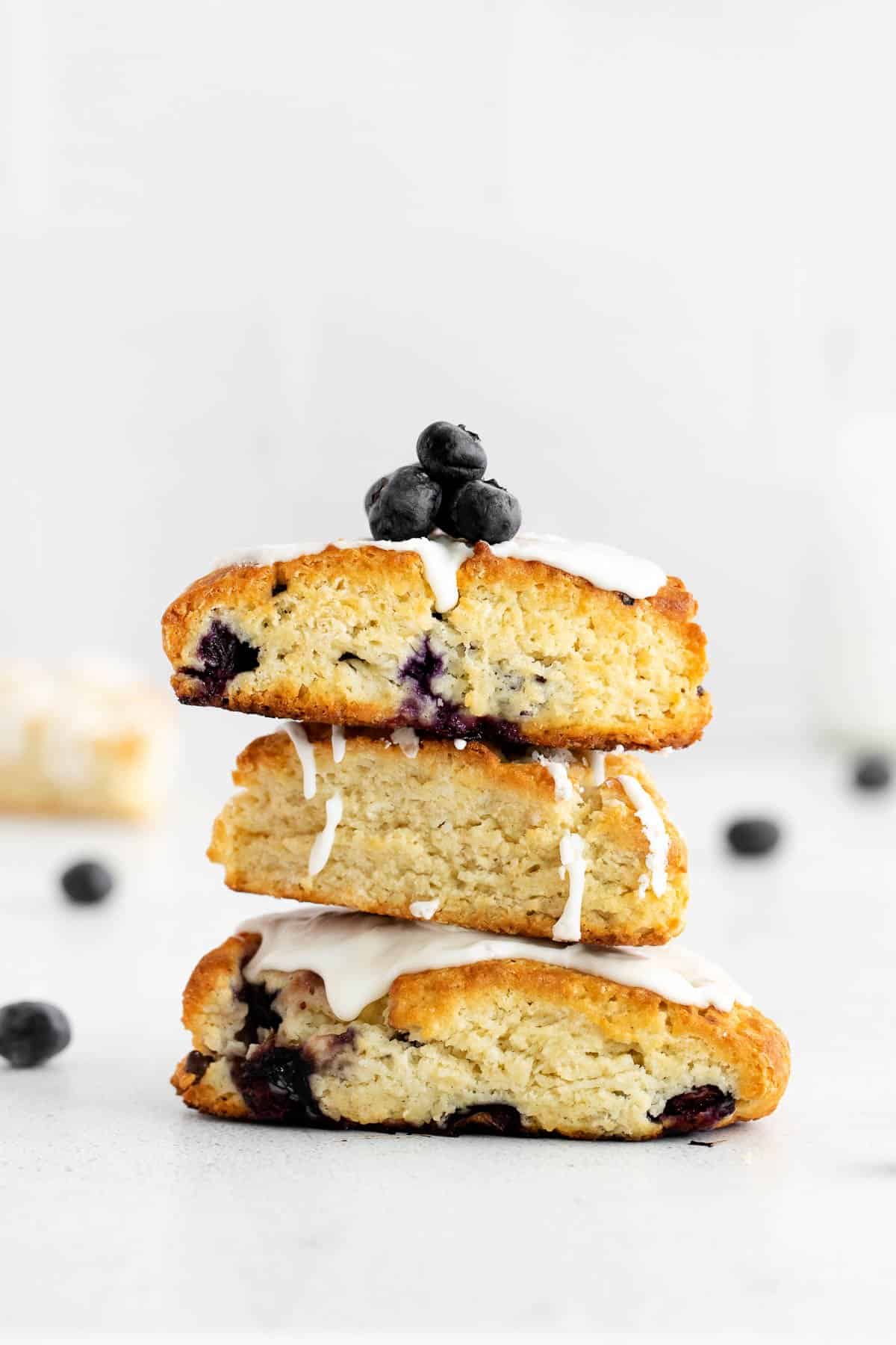 blueberry scones stacked on a plate
