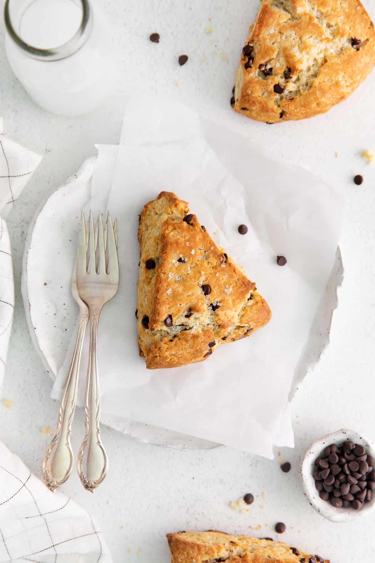 A chocolate chip scone on parchment paper