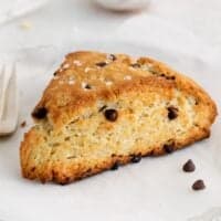 A chocolate chip scone on a plate