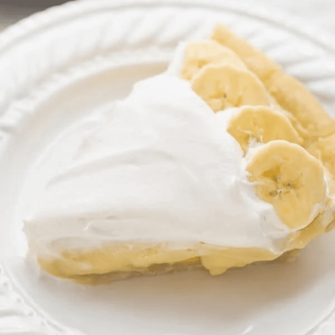 A slice of banana cream pie on a plate