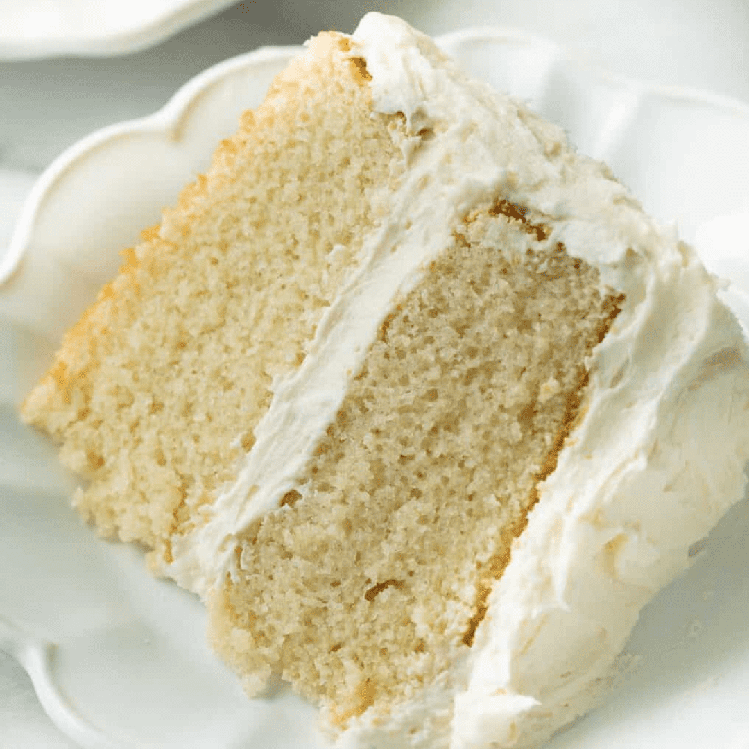 a slice of vanilla cake on a plate