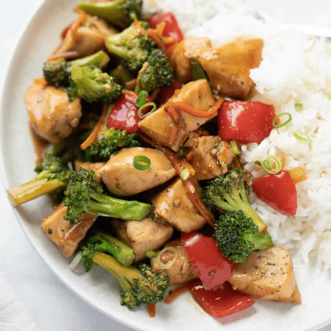 Chicken stir fry and rice on a plate