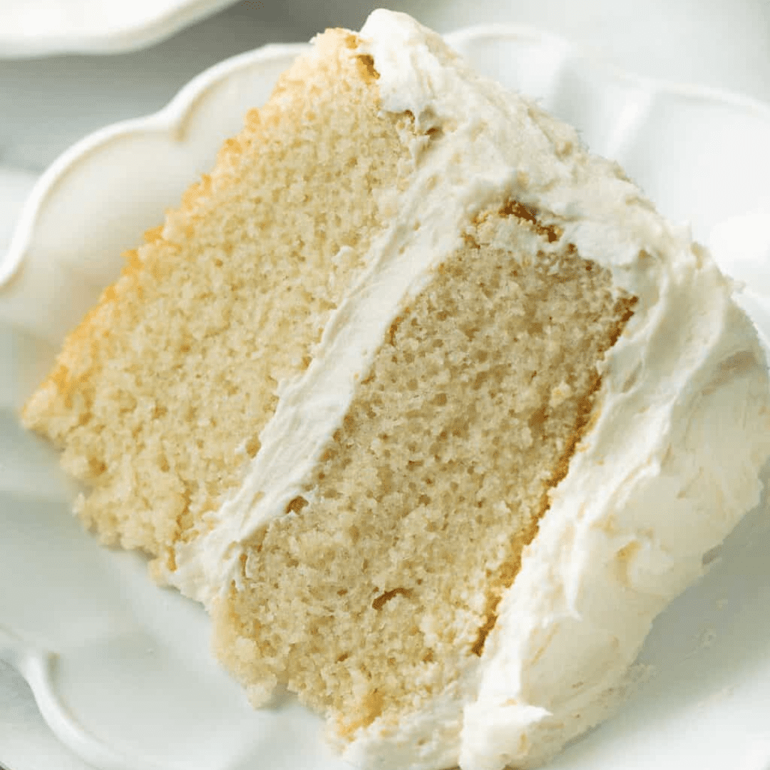 A slice of vanilla cake on a plate