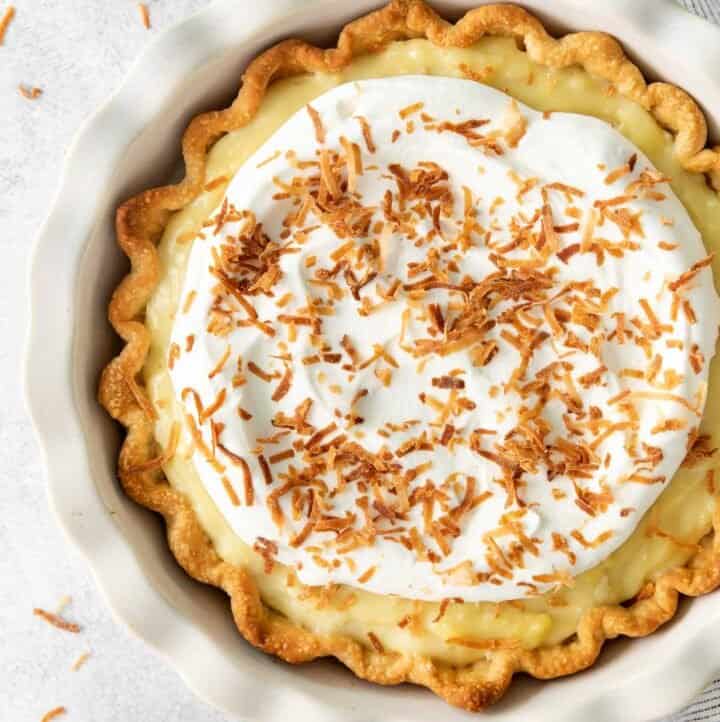 A closeup of coconut cream pie in a dish