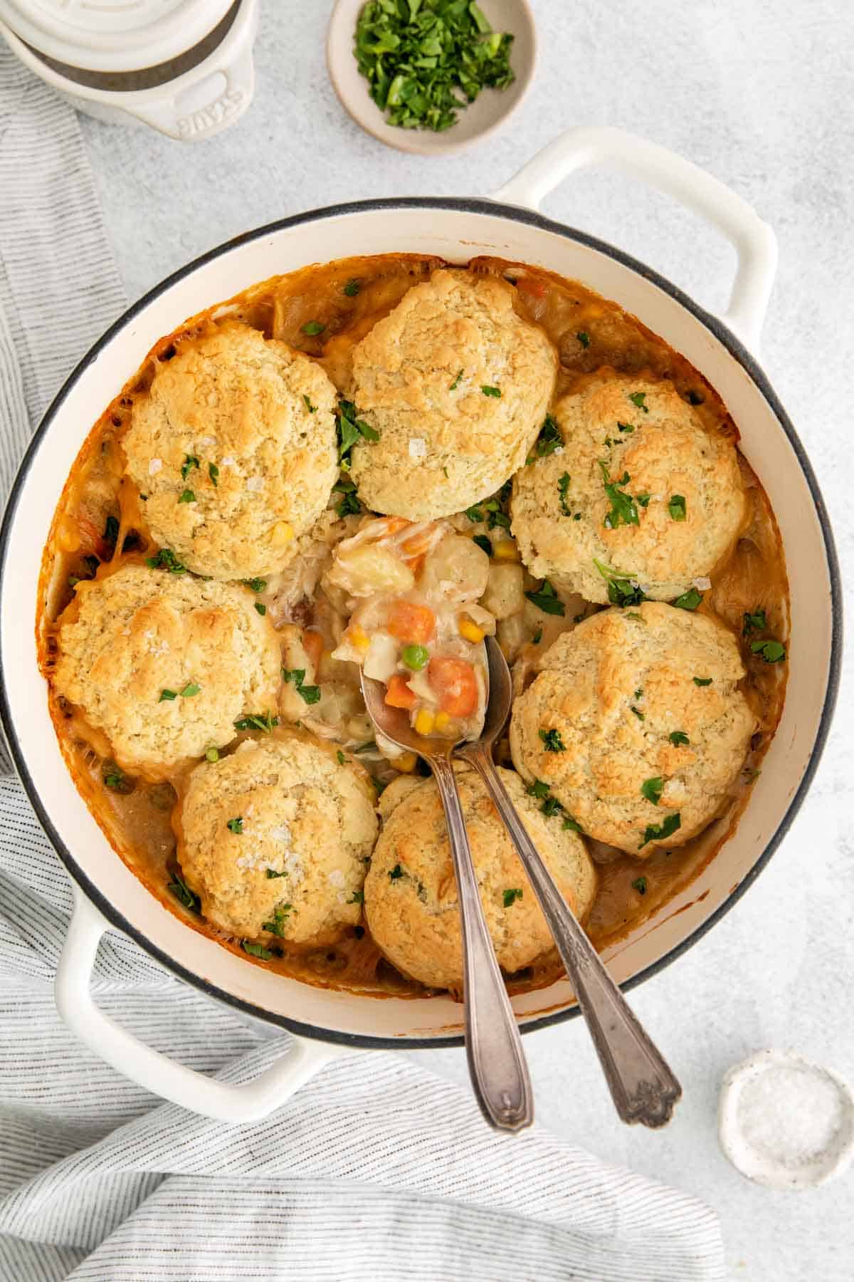 Chicken pot pie in a pot with a spoon in it