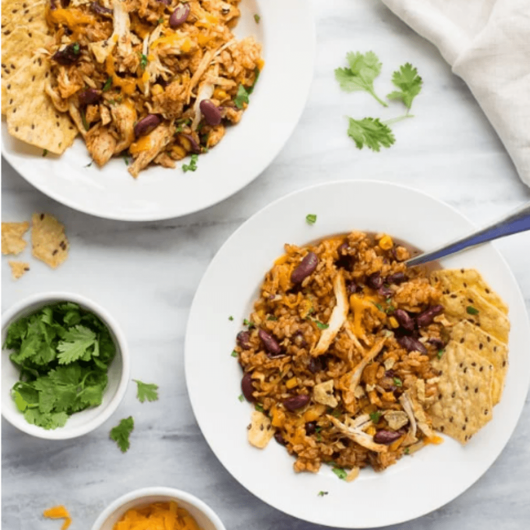 Instant Pot Southwestern chicken in bowls with toppings