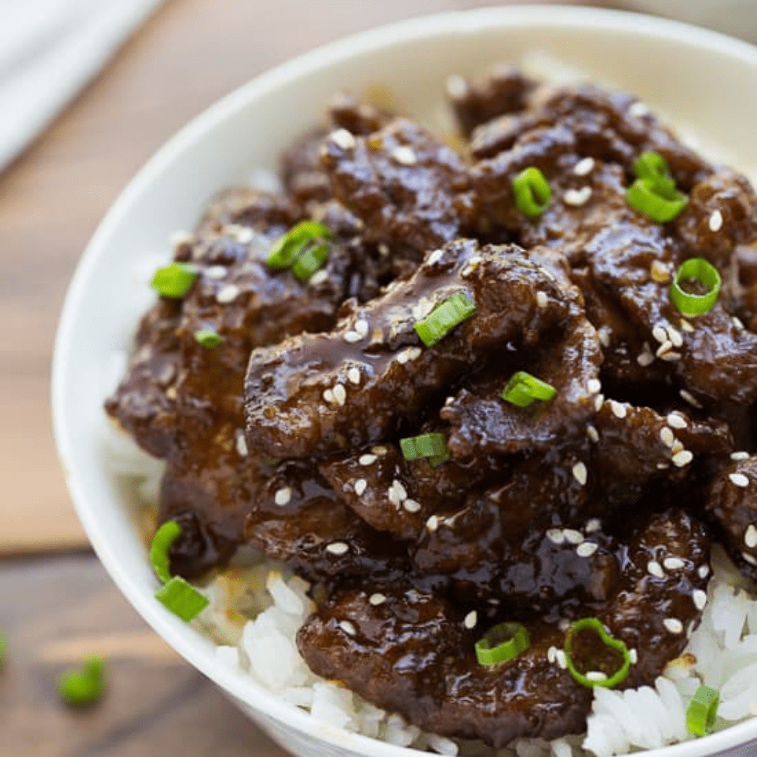 Beef teriyaki over rice in a bowl