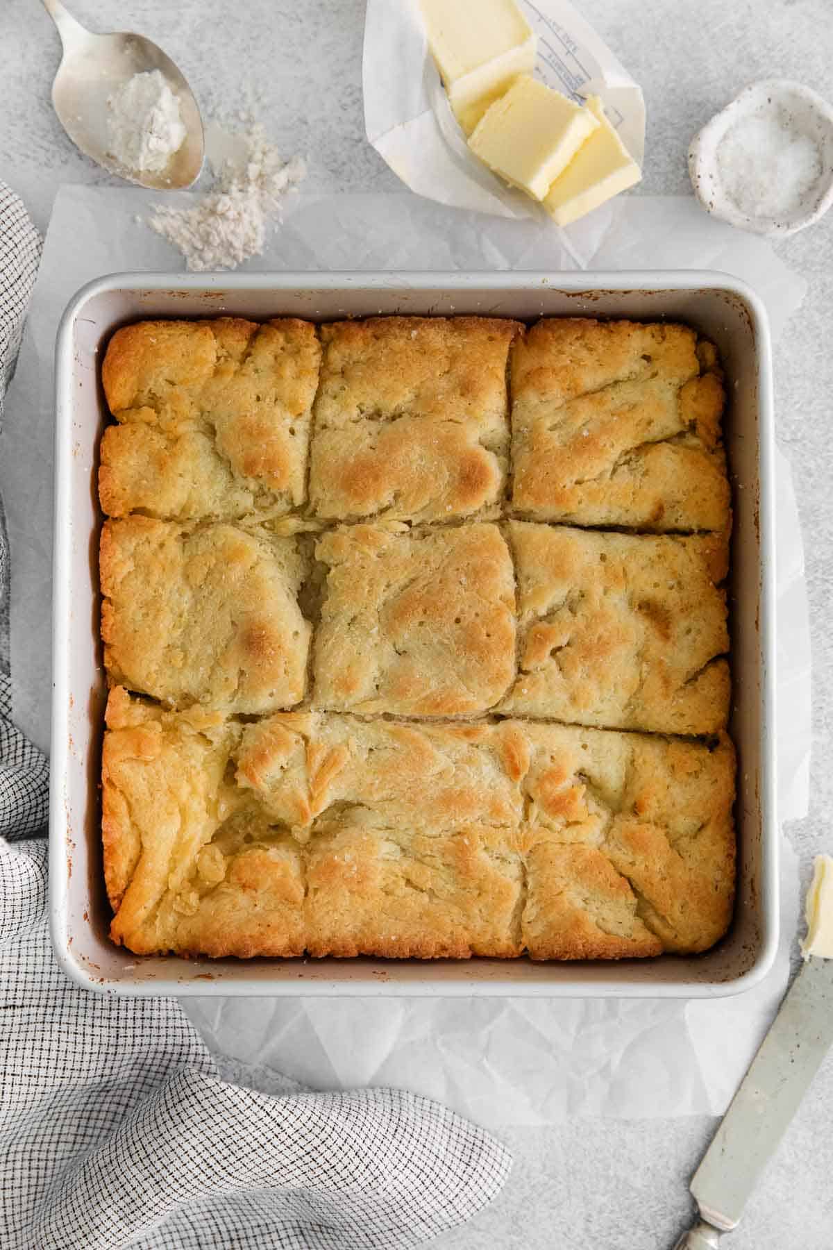 A overhead view of gluten-free biscuits in a baking dish