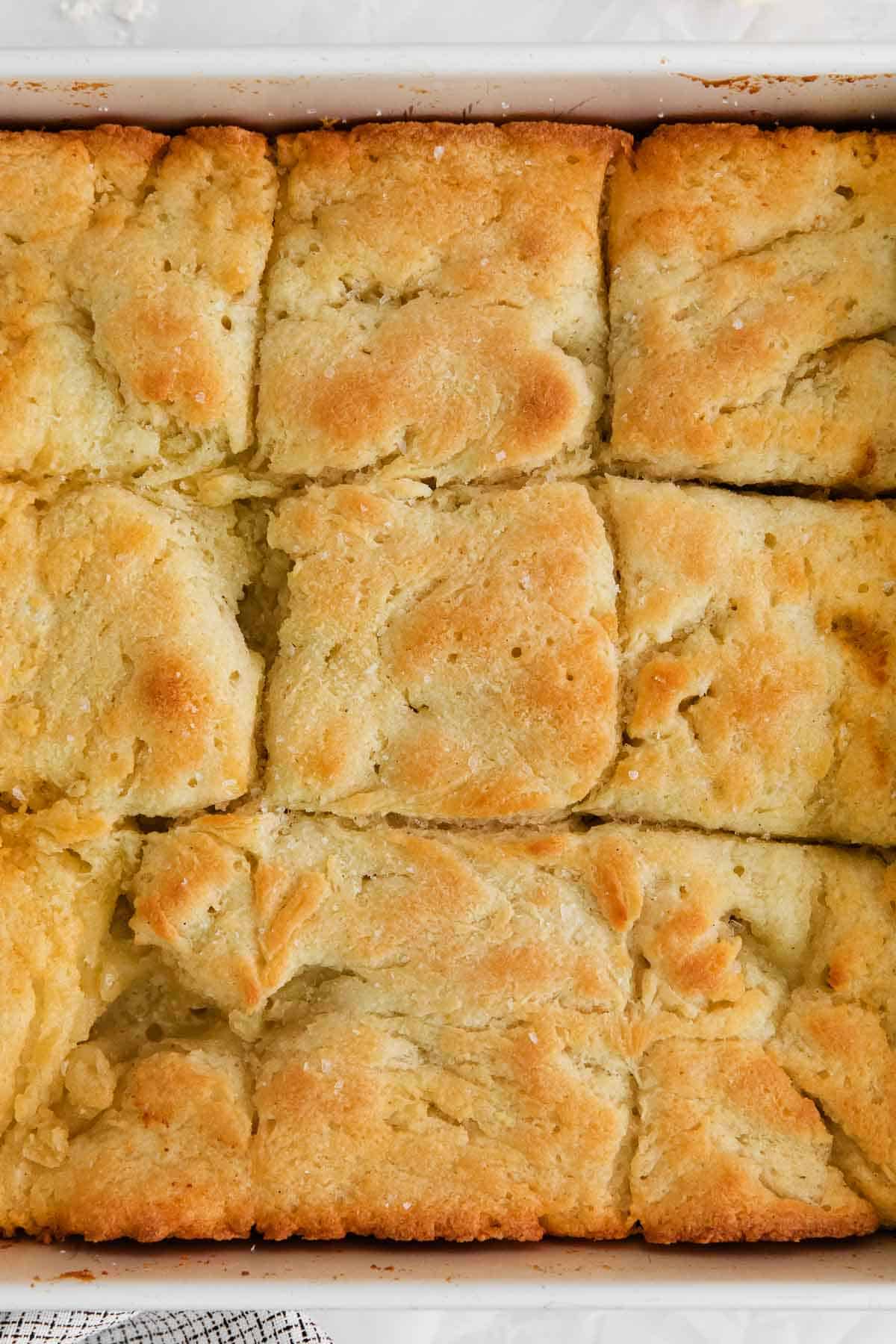 A close-up of gluten-free biscuits in a baking dish