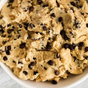 A close-up shot of edible cookie dough in a bowl