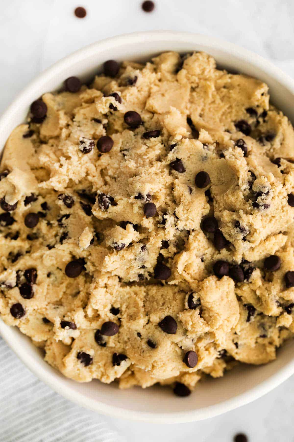 A close-up of edible cookie dough in a bowl