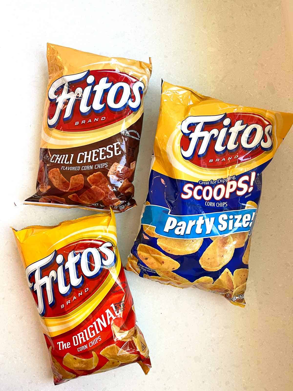 3 bags of fritos on white counter