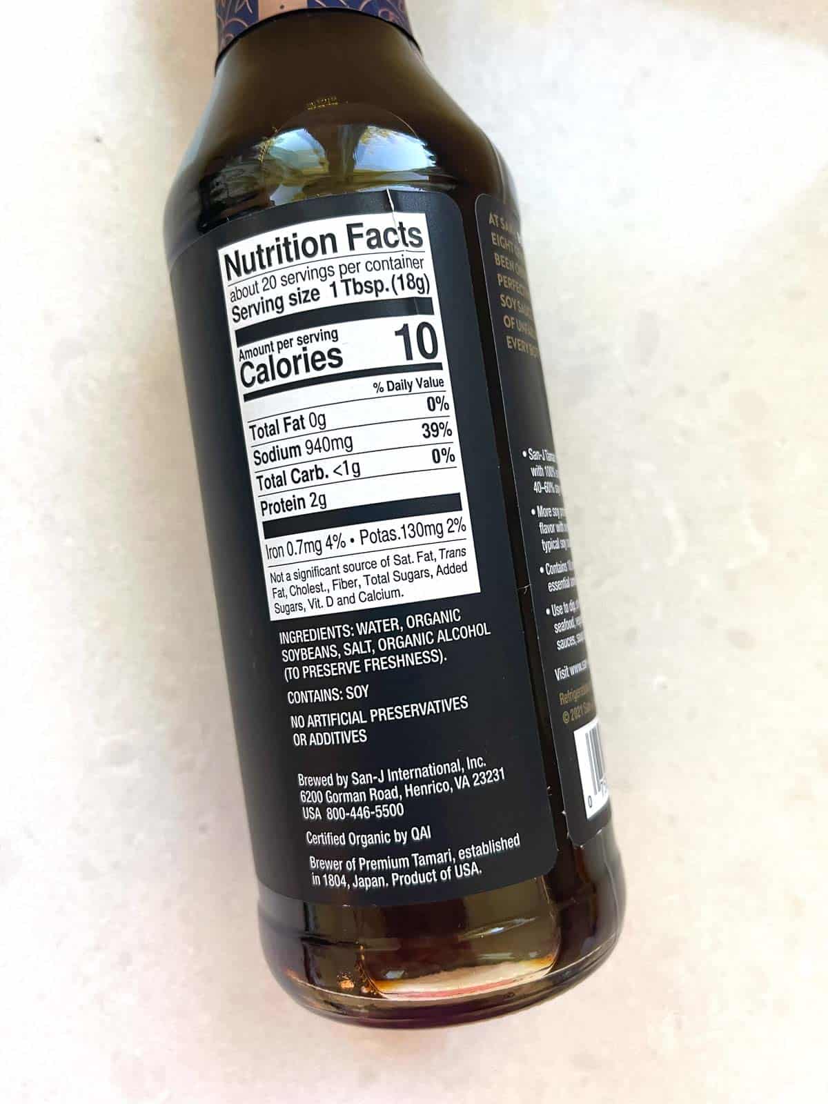 bottle of soy sauce with gluten free ingredient label on white counter