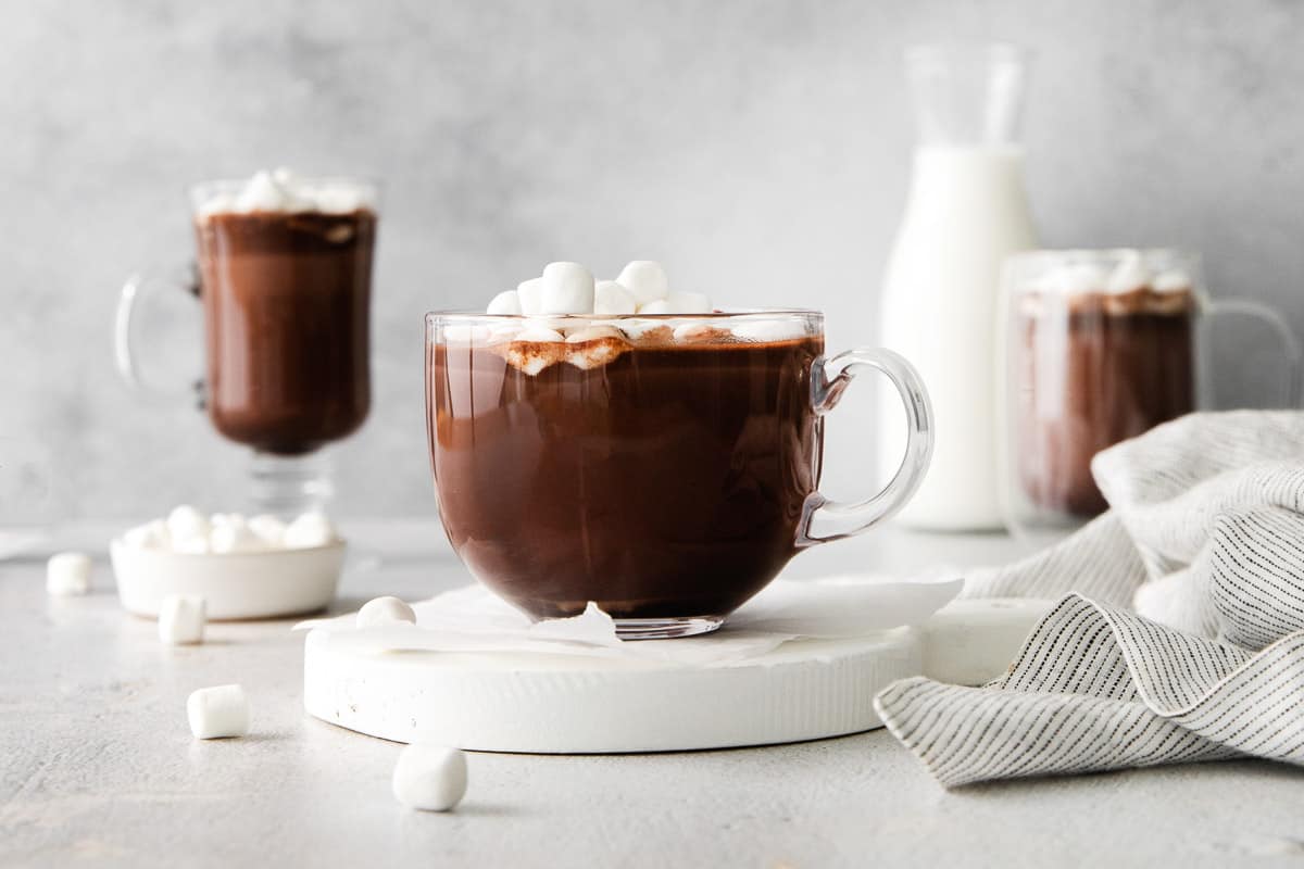 A wide shot of three mugs of hot chocolate