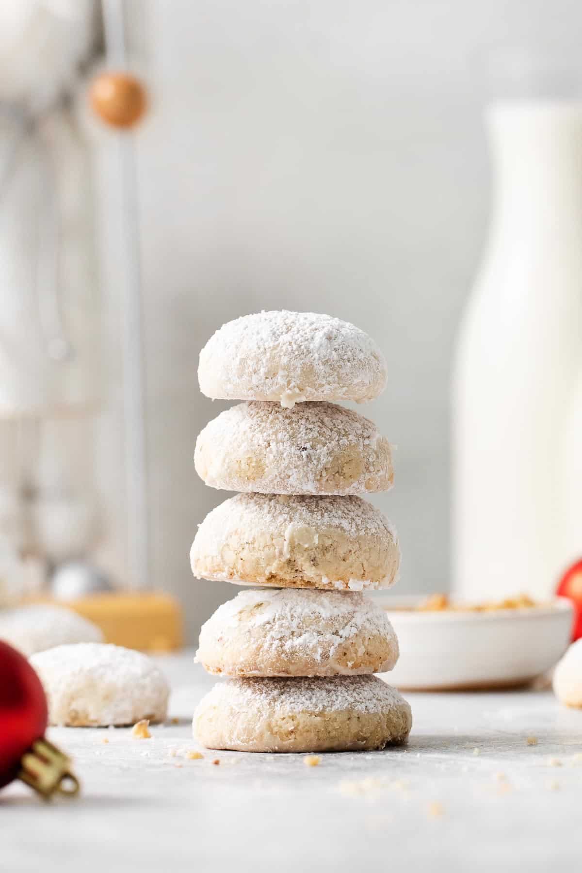 A stack of gluten-free snowball cookies on a counter top
