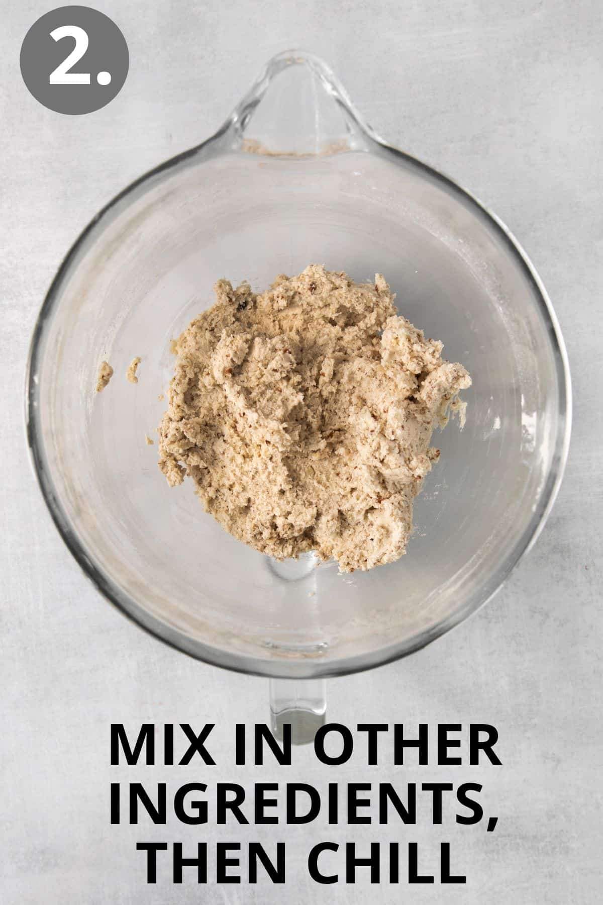 Dry ingredients mixed in with butter and sugar in a bowl