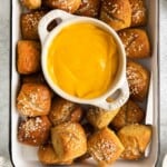 Pretzel bites with cheese sauce in a dish
