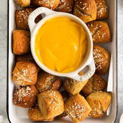 Pretzel bites with cheese sauce in a dish