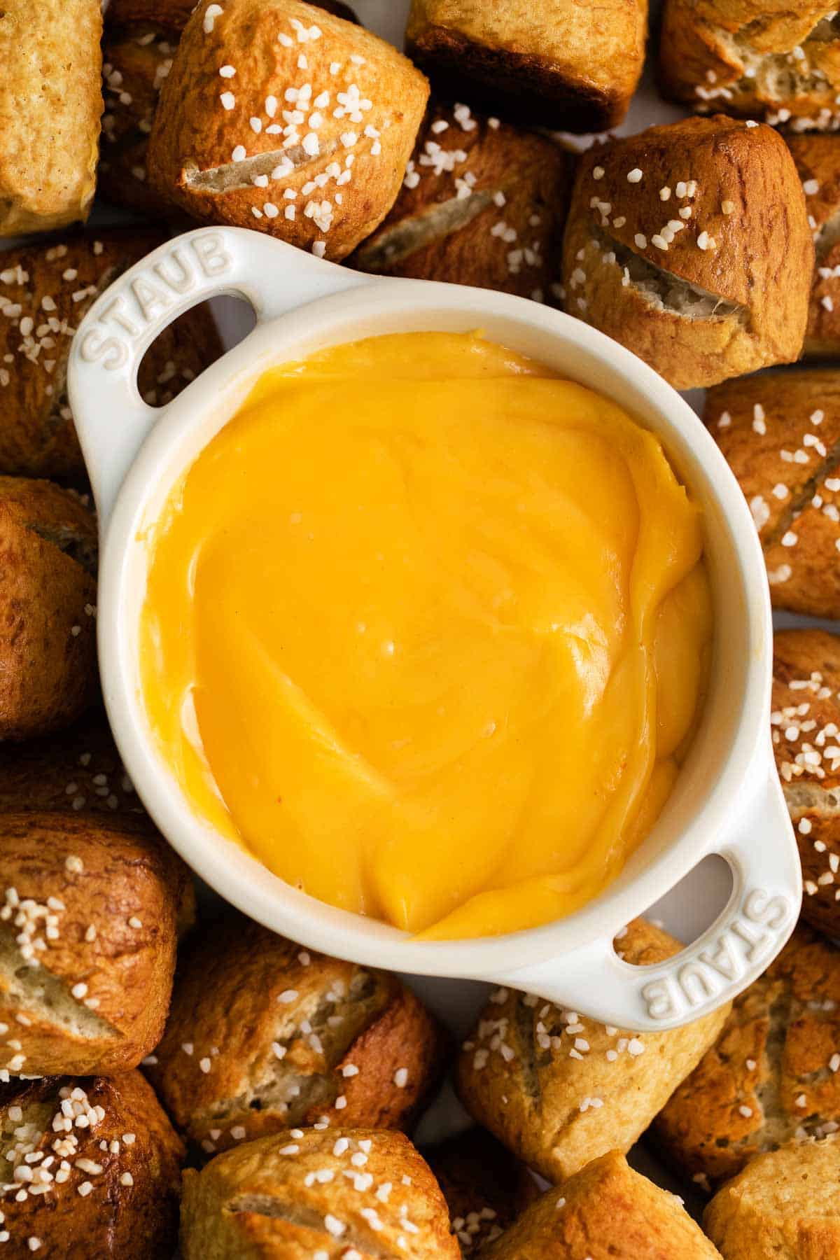 A close-up photo of pretzel cheese sauce