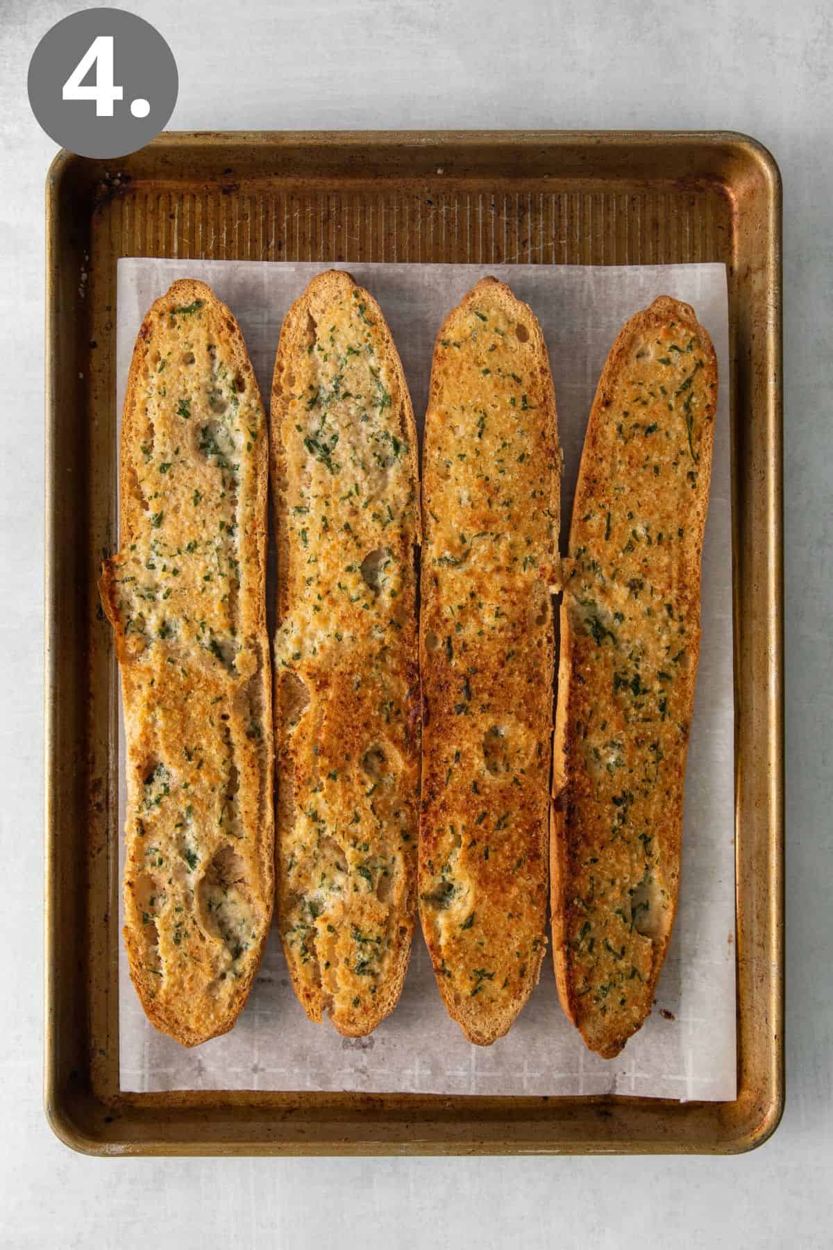 Gluten-free garlic bread on a baking sheet