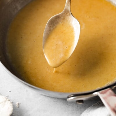 Gluten-free roux in a skillet with a spoon