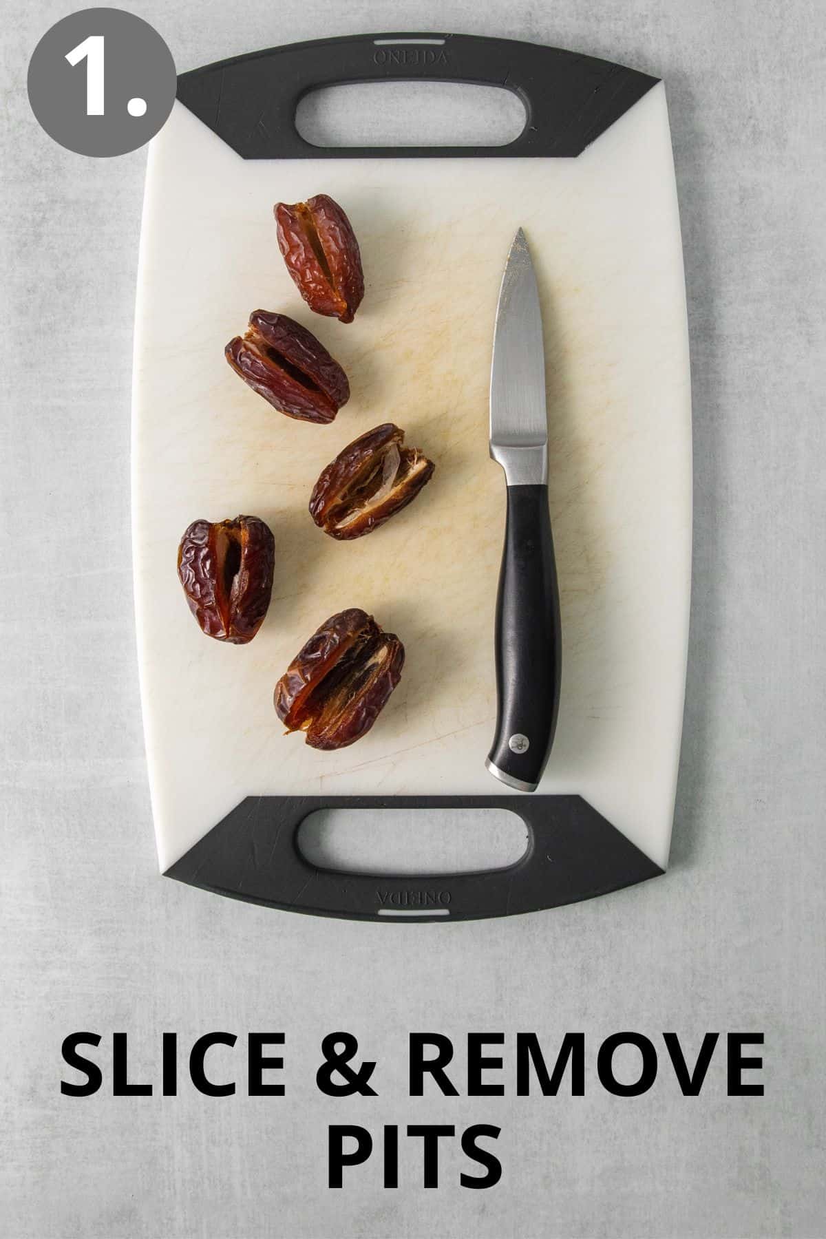 Dates and a knife on a cutting board