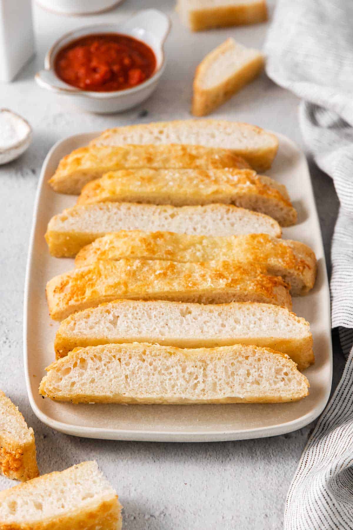 Gluten-free breadsticks on a baking sheet