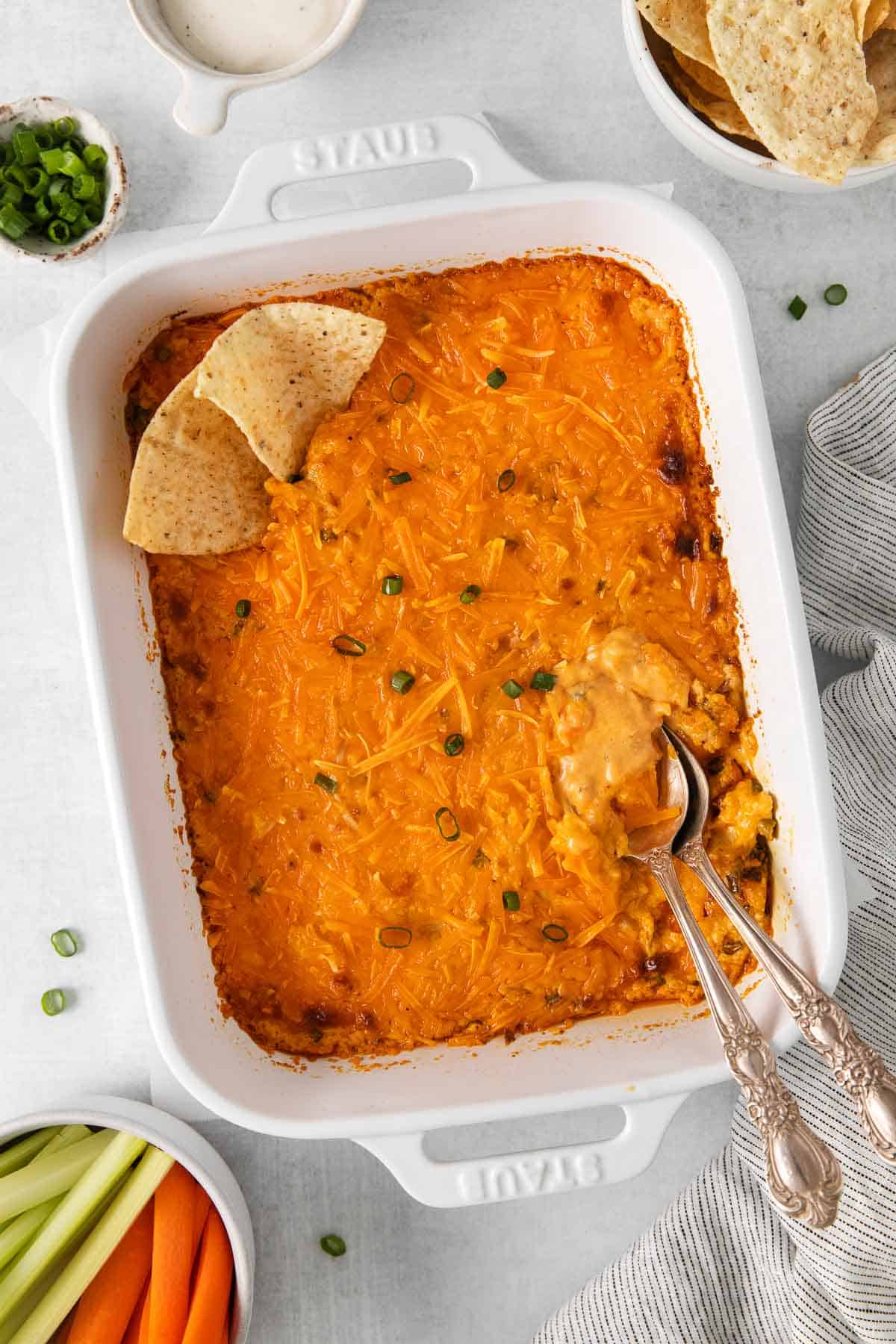 A overhead view of buffalo chicken dip in a baking dish