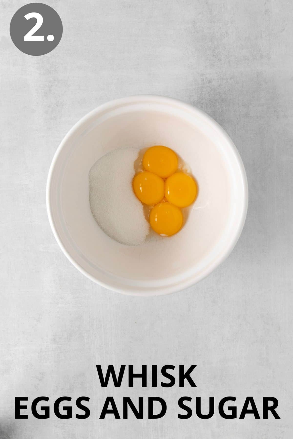 Sugar and eggs in a mixing bowl