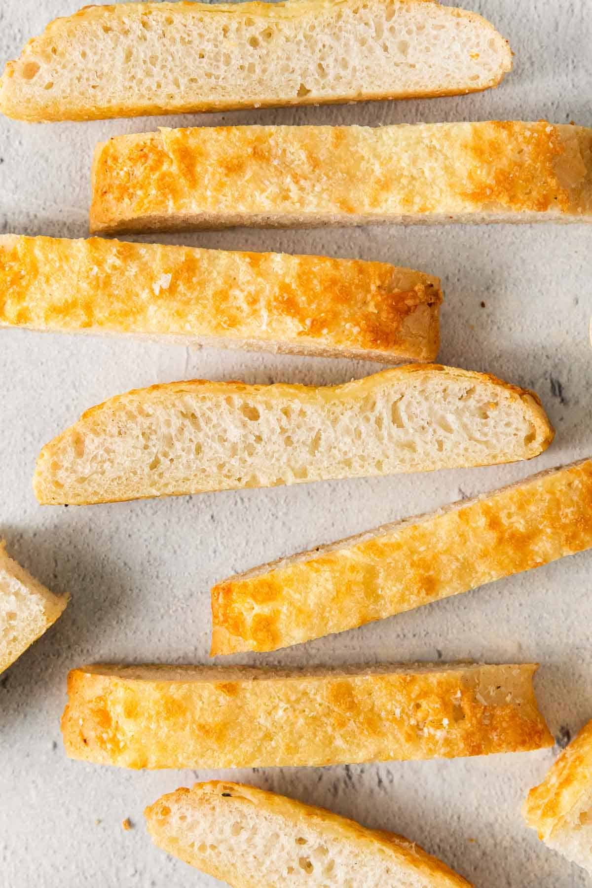 Gluten-free breadsticks spread across a counter top