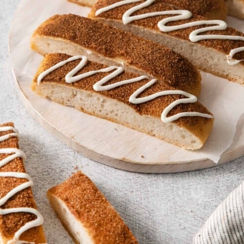 Gluten-free cinnamon breadsticks on a serving board
