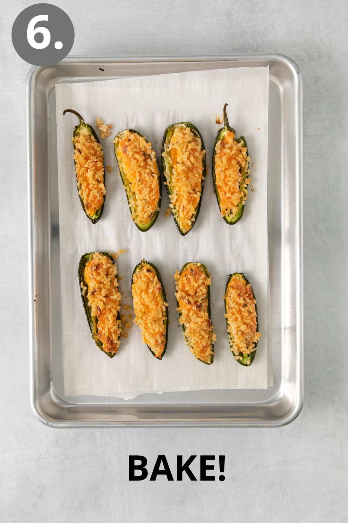 Baked jalapeno poppers on a baking sheet