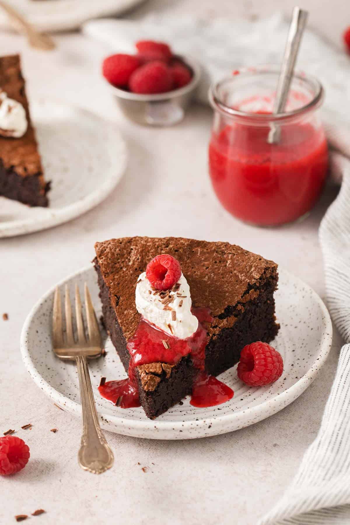 Flourless chocolate torte with raspberry coulis on top