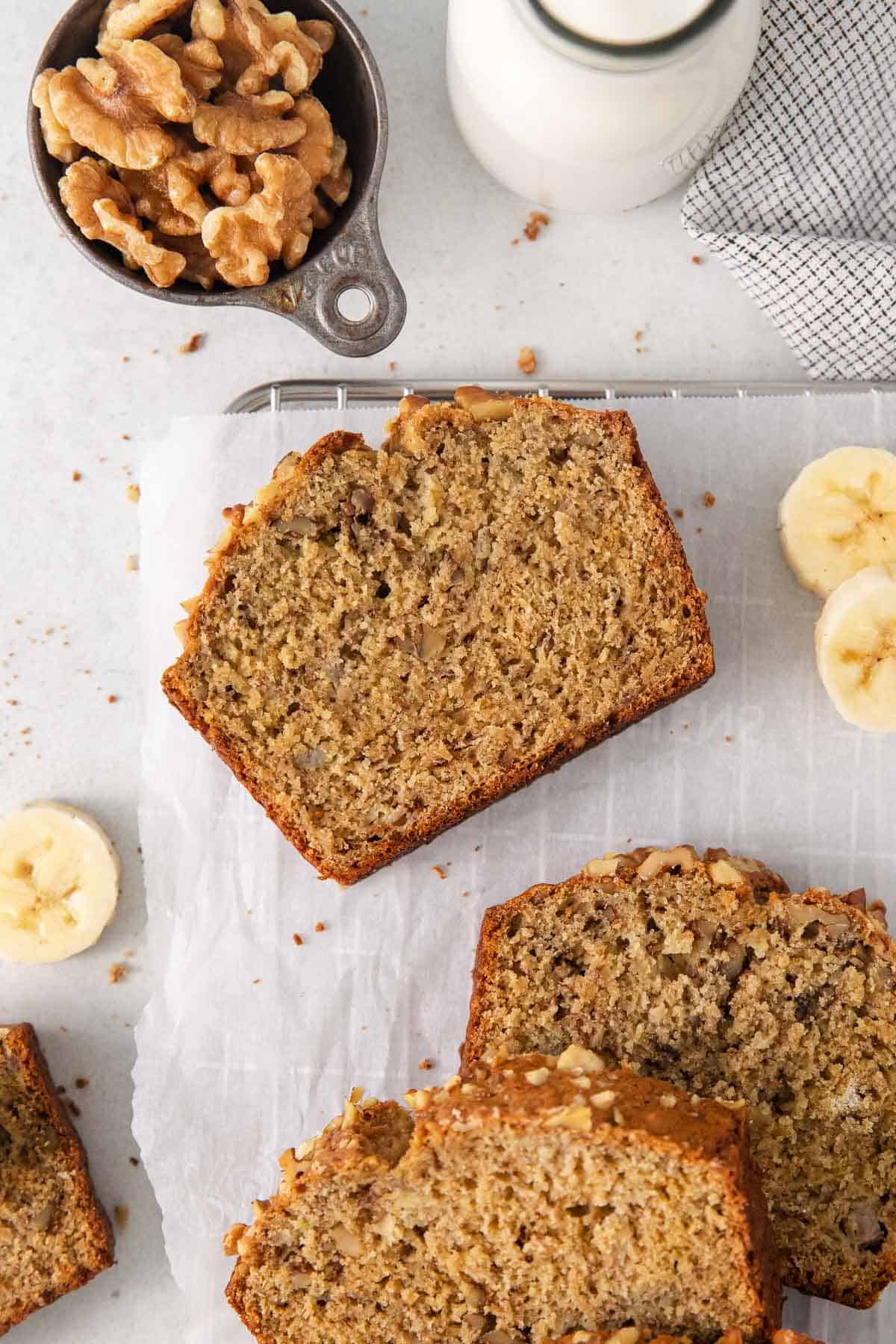 A sice of f oat flour banana bread on a piece of parchment