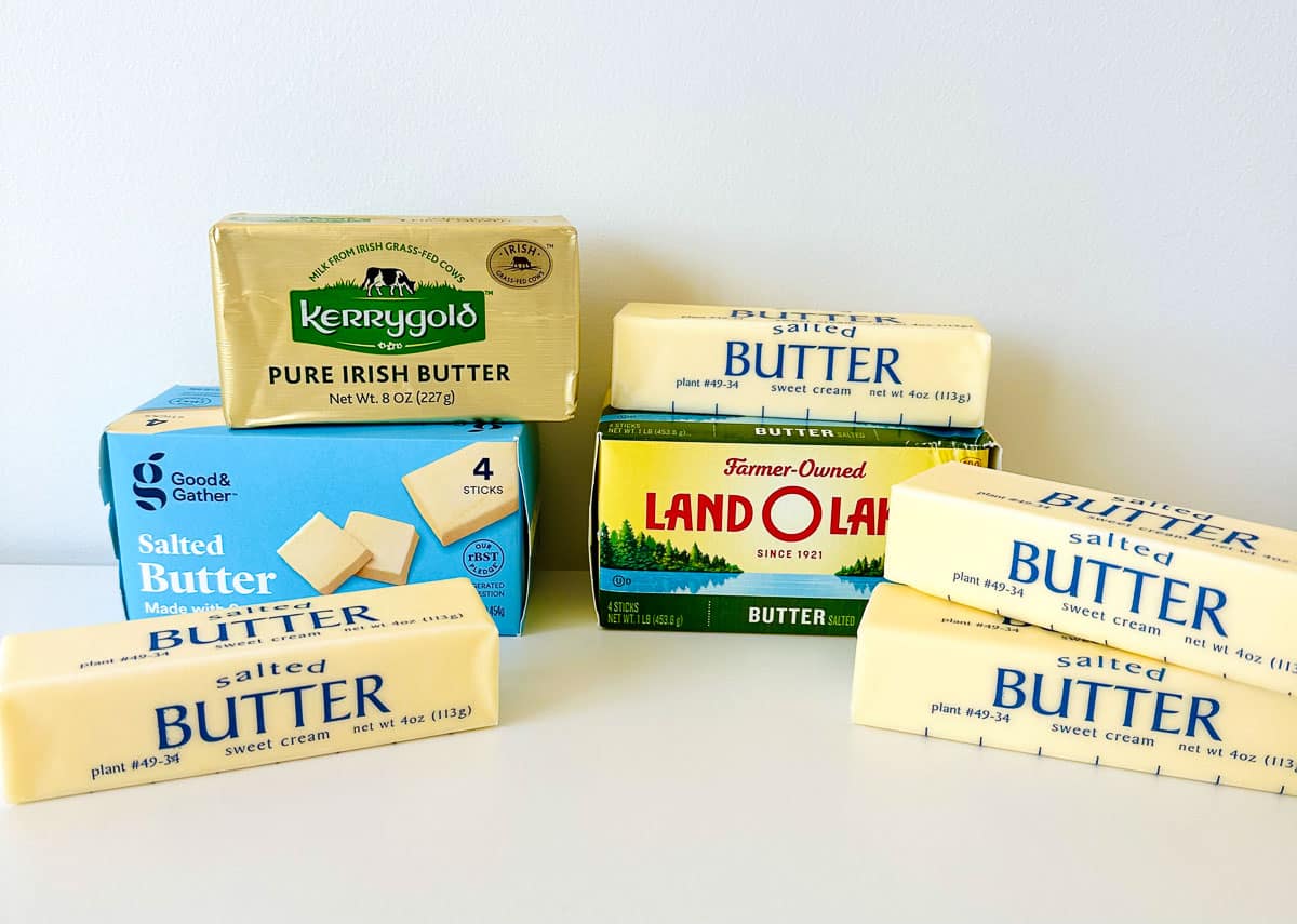 different brands of butter stacked on top of each other