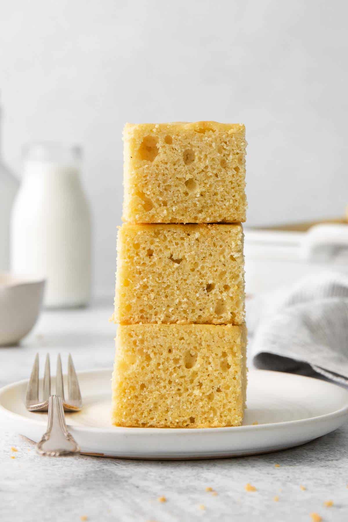 Slices of gluten-free cornbread stacked on a plate